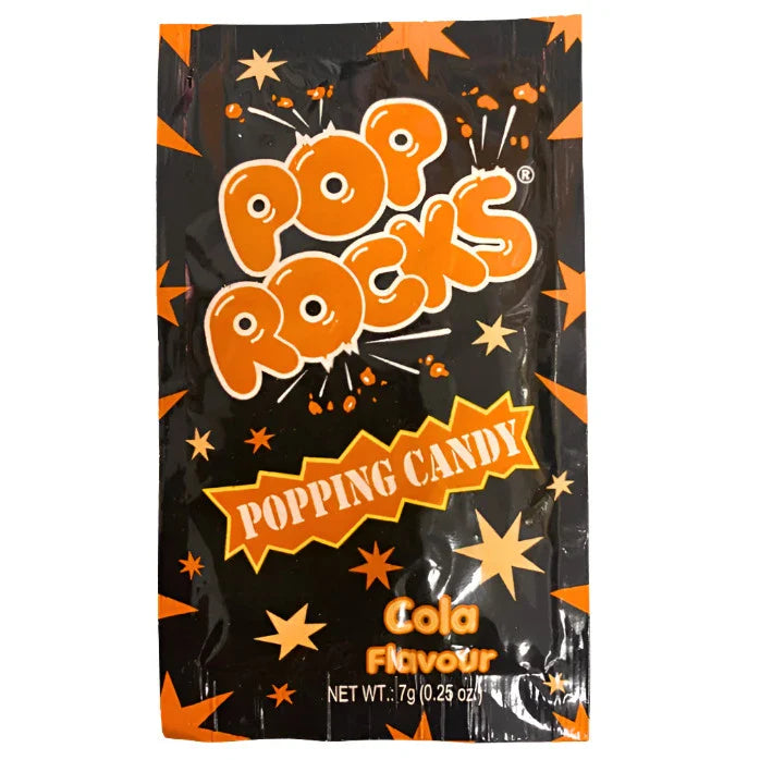 Packet of Pop Rocks popping candy in cola flavor with orange and black packaging.