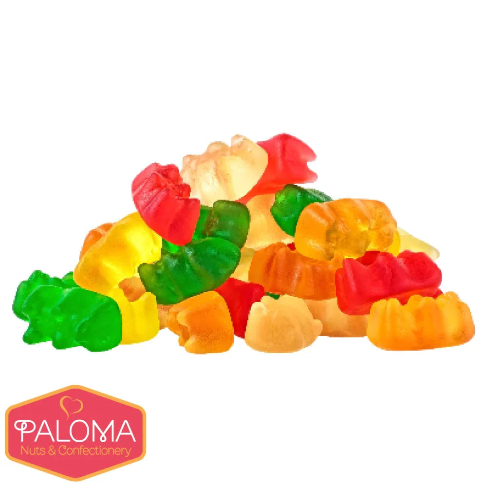 Colorful gummy candies shaped like various fruits and animals piled together.